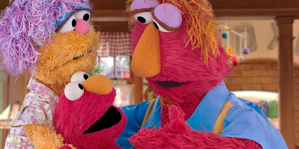 Elmo’s parents, Louie and Mae, talking to Elmo.